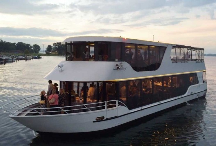 Guests aboard a private evening cruise boat on Lake Minnetonka.